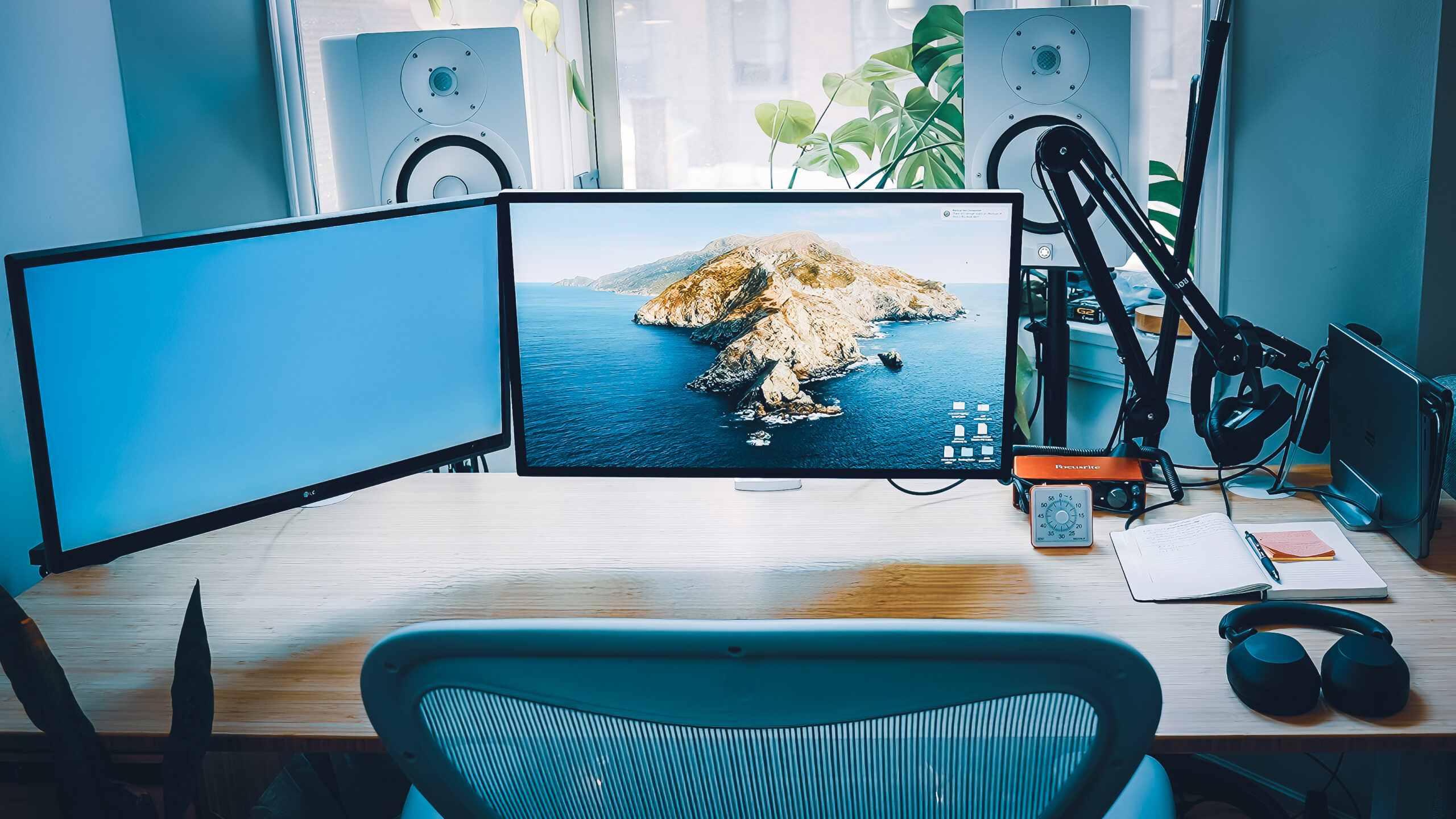 Premium Photo  Workstation with adjustable height desk cozy chair and  privacy screen created with generative ai